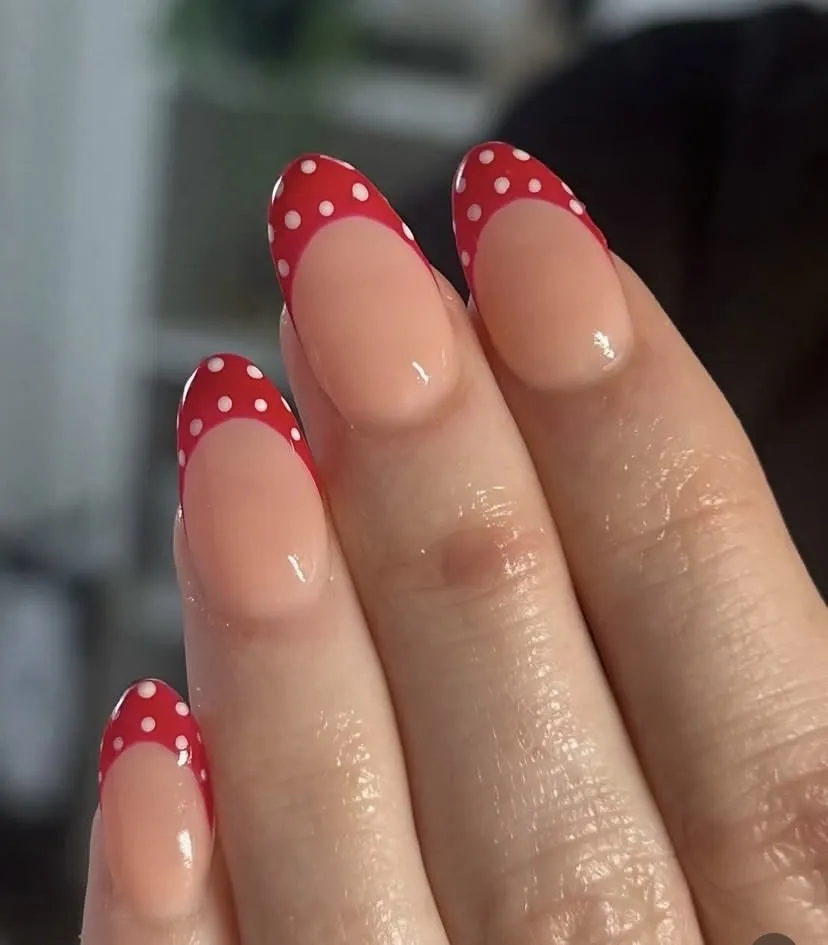 Cherry red French tips with white polka dots, by Beauty by Amy