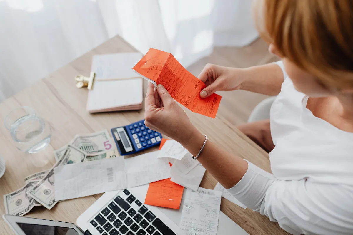 Calculator and receipts spread on desk