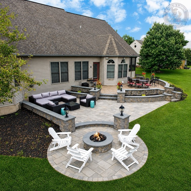 Custom patio paver and outdoor firepit installation with stone pavers and backyard hardscaping work by Earl’s Lawn Service in Union, Kentucky.