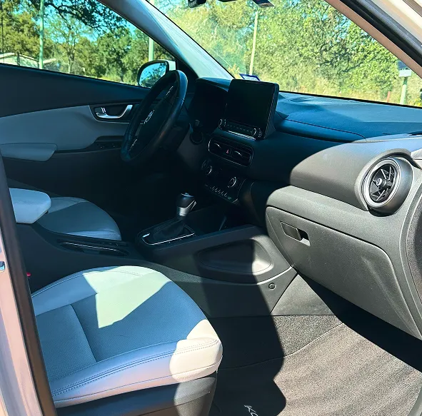 Clean car interior with spotless front seats, dashboard, and center console after professional auto detailing.