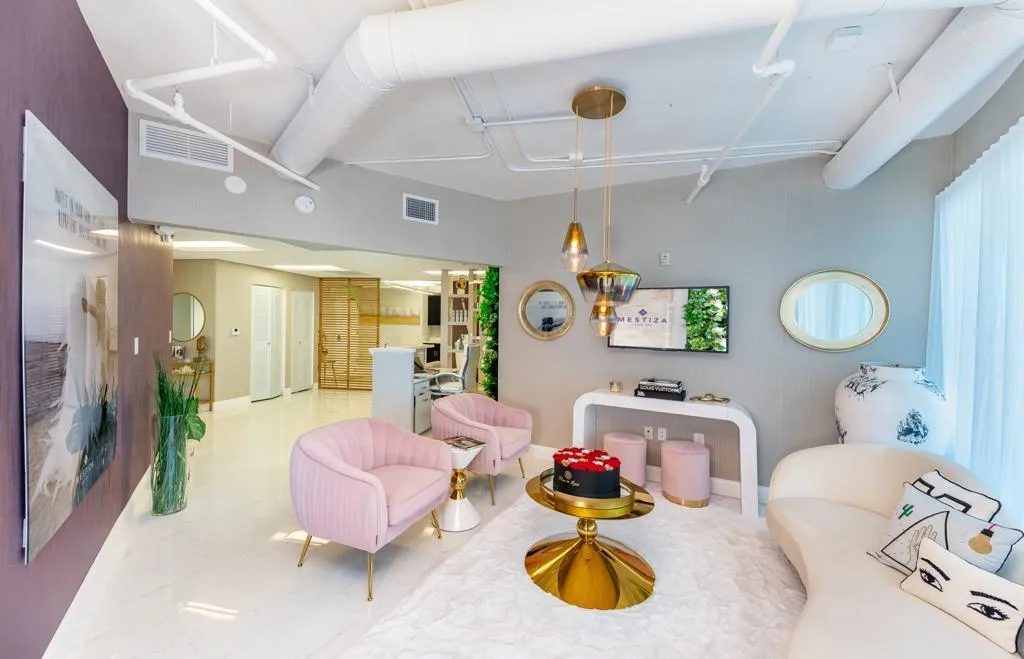 woman signing on white printer paper beside woman about to touch the documents