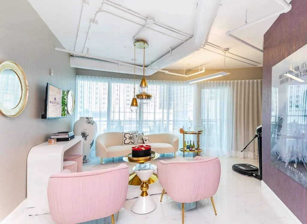 woman signing on white printer paper beside woman about to touch the documents