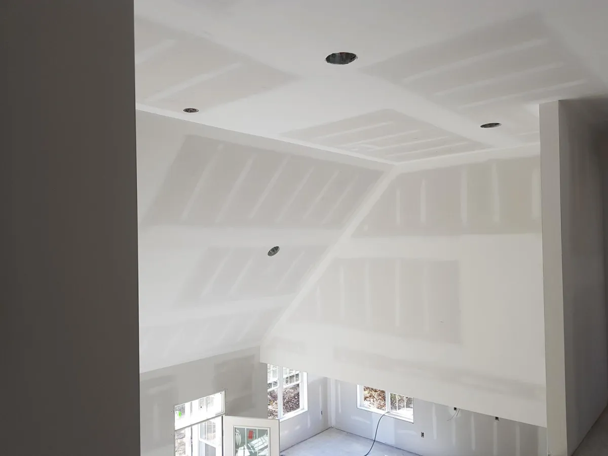 white robot near brown wall