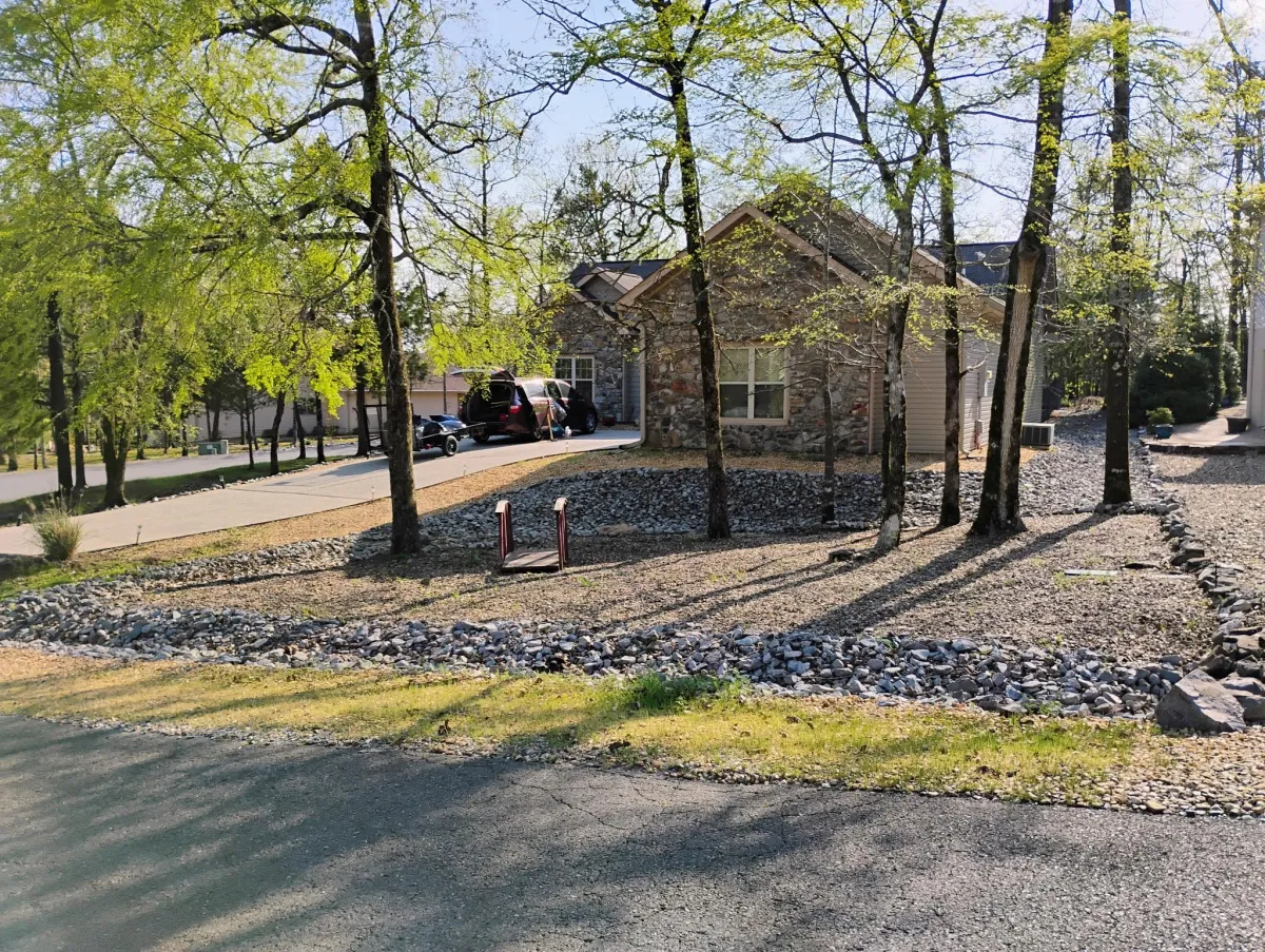 Rocky front yard landscape with drought-tolerant plants in Hot Springs AR