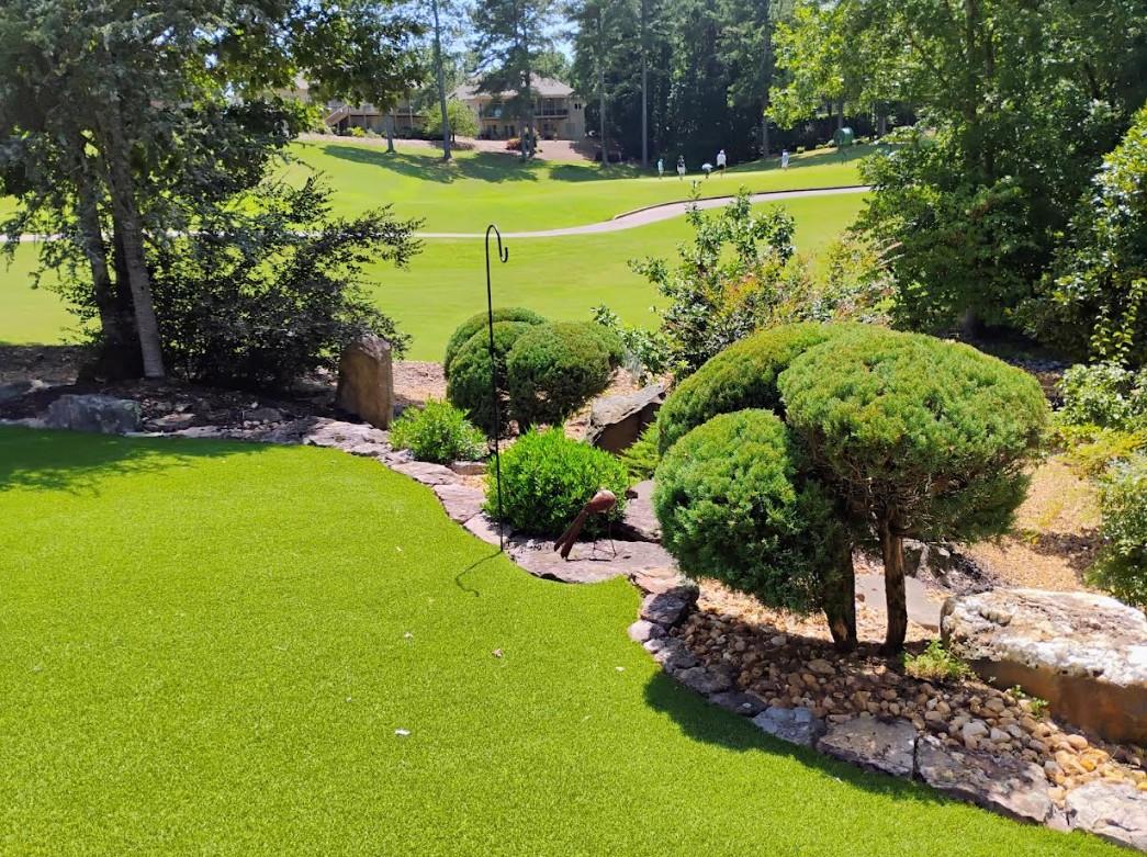Rocky front yard landscape with drought-tolerant plants in Hot Springs AR