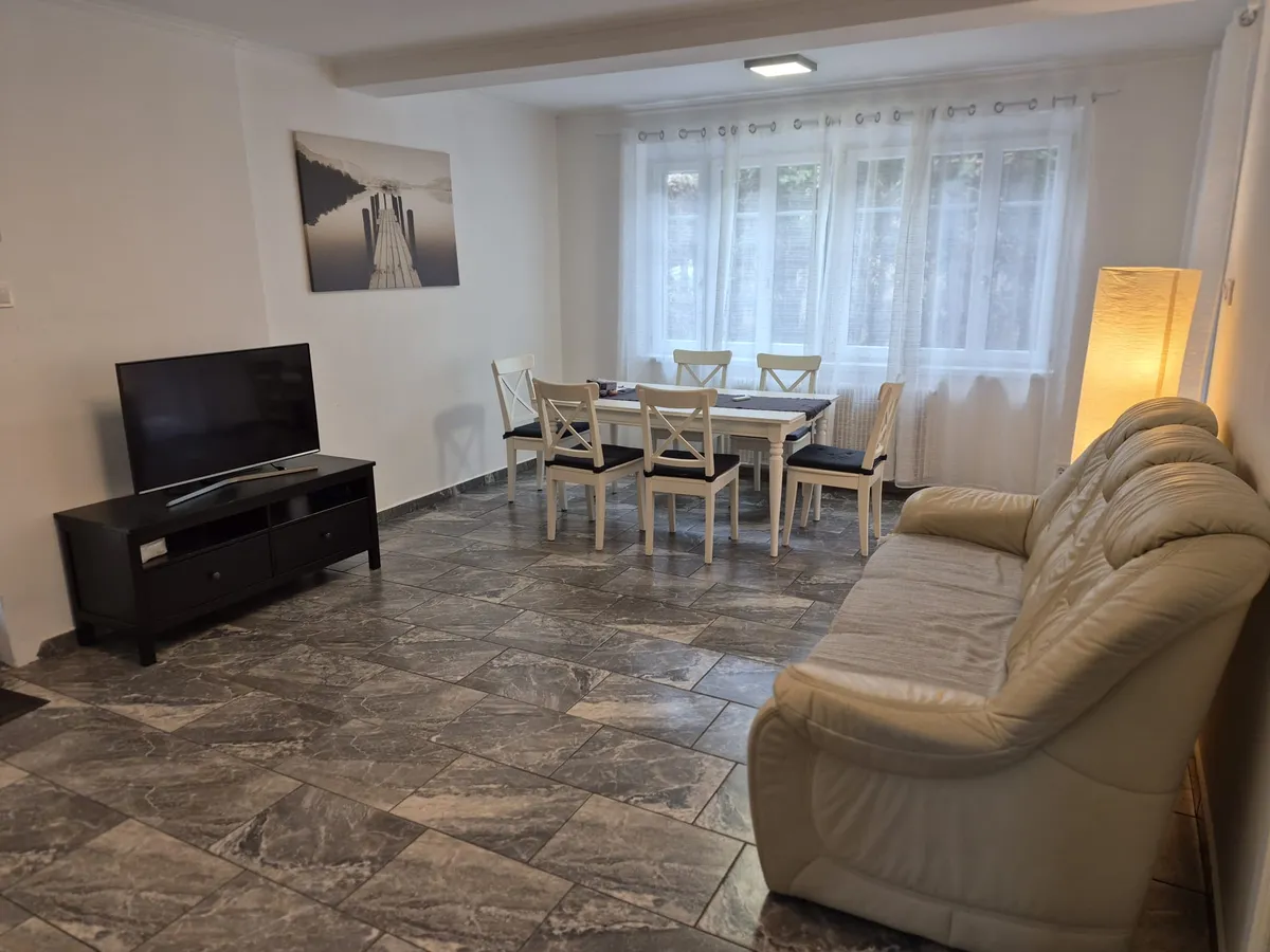 two gray sofas beside pool in room