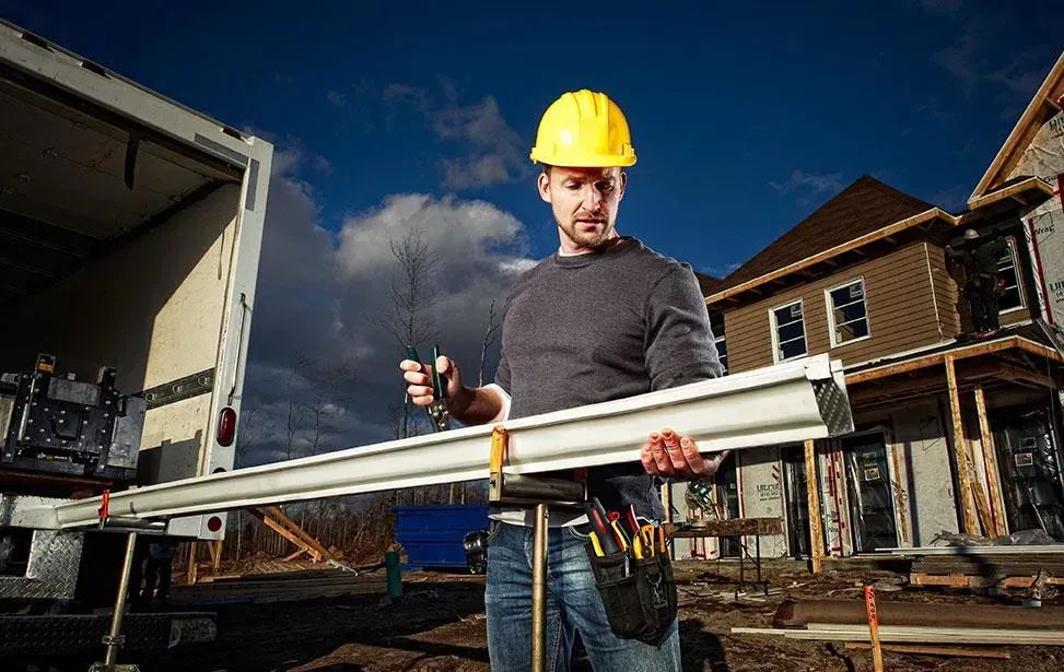 Image of Professional installer preparing a high-quality gutter guard system in Brantford