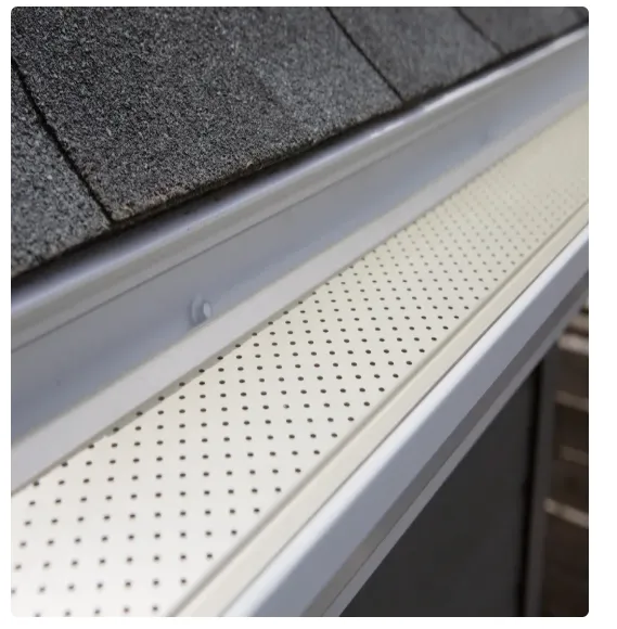 Image of Seamless gutter guard installation on a residential home to prevent leaf buildup