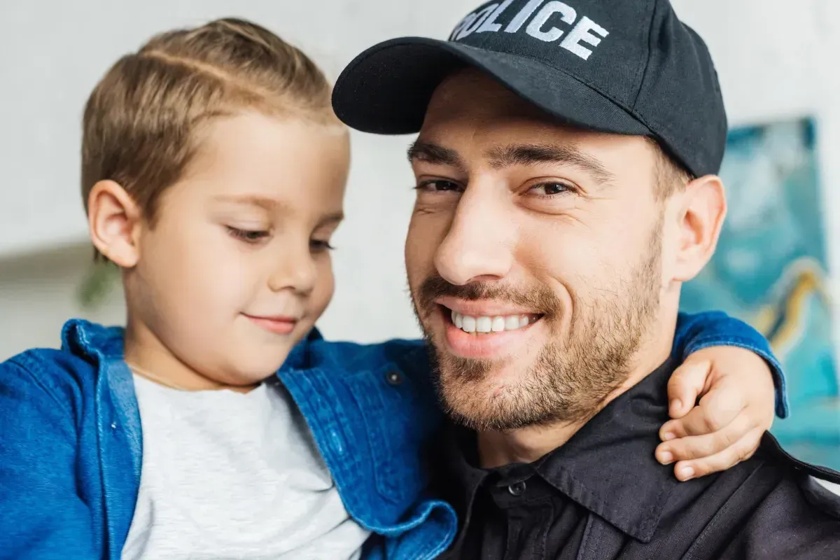 Police officer holding a child