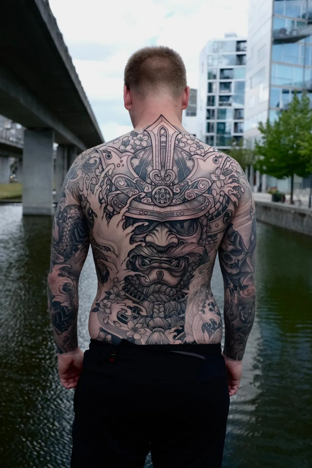 person with tattoo on right arm