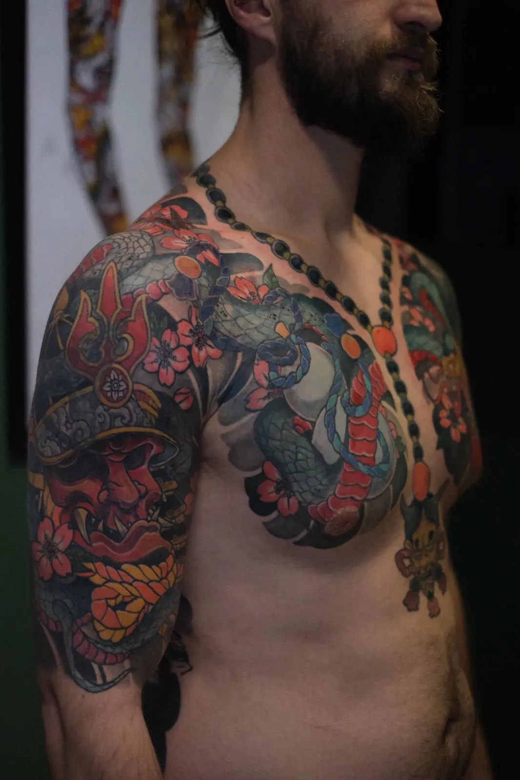 person in blue denim shorts and white nike sneakers standing on gray concrete floor