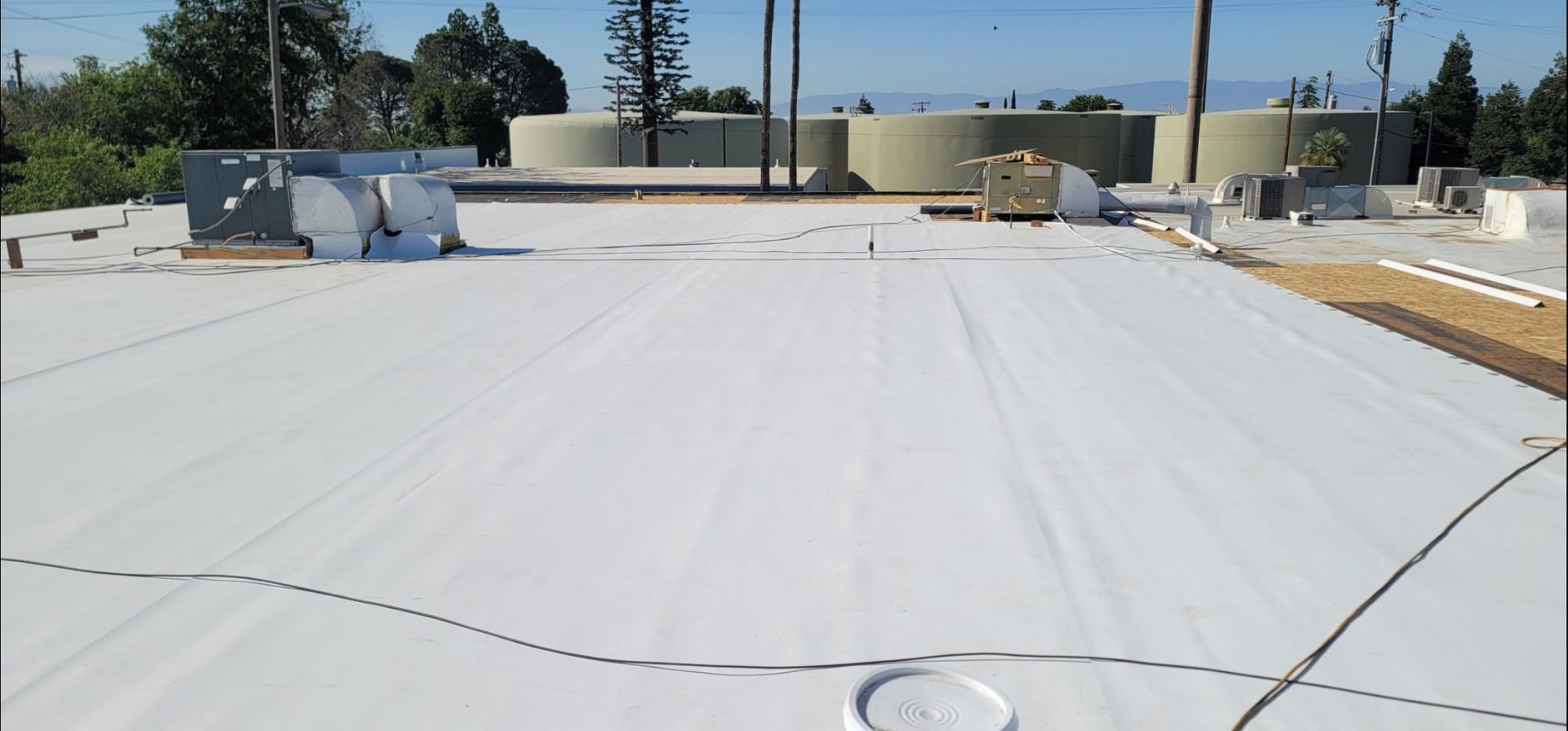 TPO membrane being installed on a Bakersfield commercial flat roof