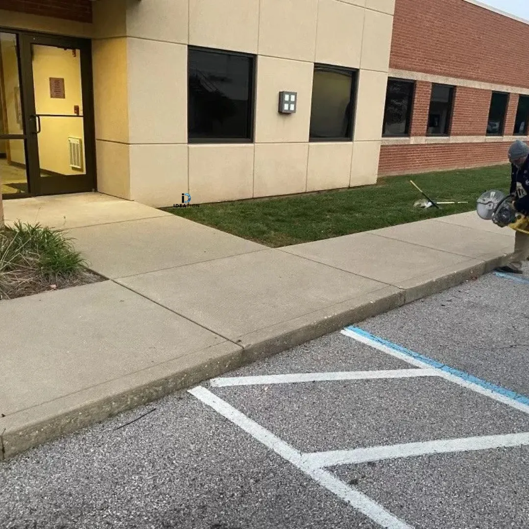 Completed residential driveway and site grading by RidgeForge Construction in warm late-afternoon light.