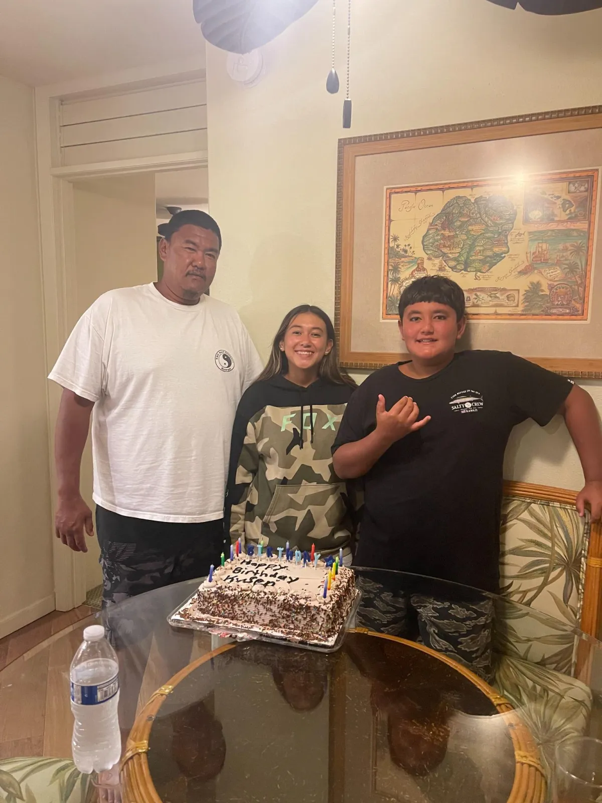 Tyson Yamashita with family celebrating birthday in Kalaheo, Kauai, owner of Kyani Equipment Services land management company