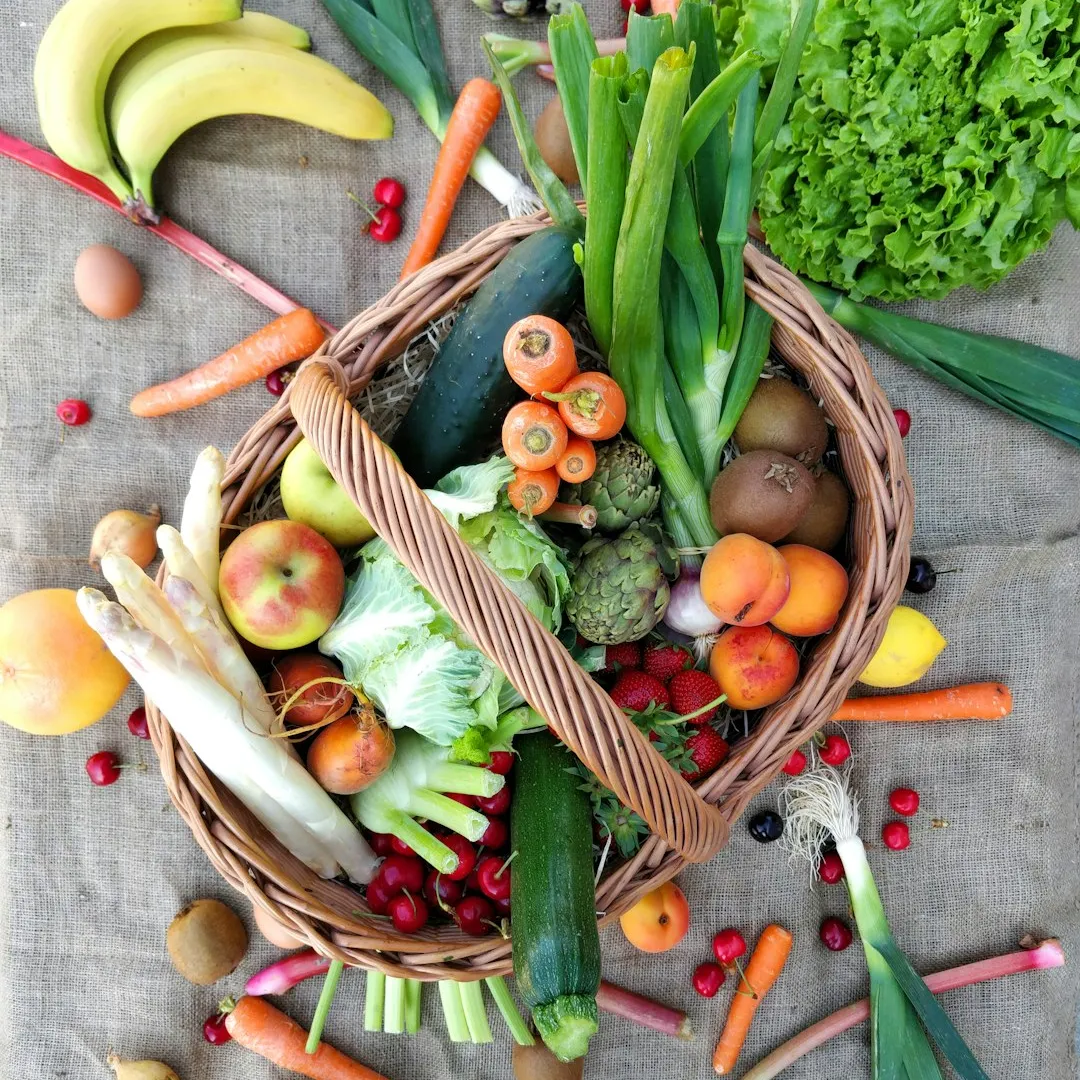 Basket overflowing with mixed fruits and vegetables