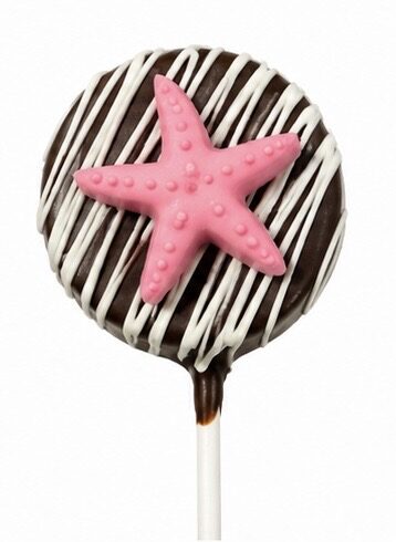 Chocolate cake pop decorated with a pink starfish and white drizzle, by Sugar Coast Sweets