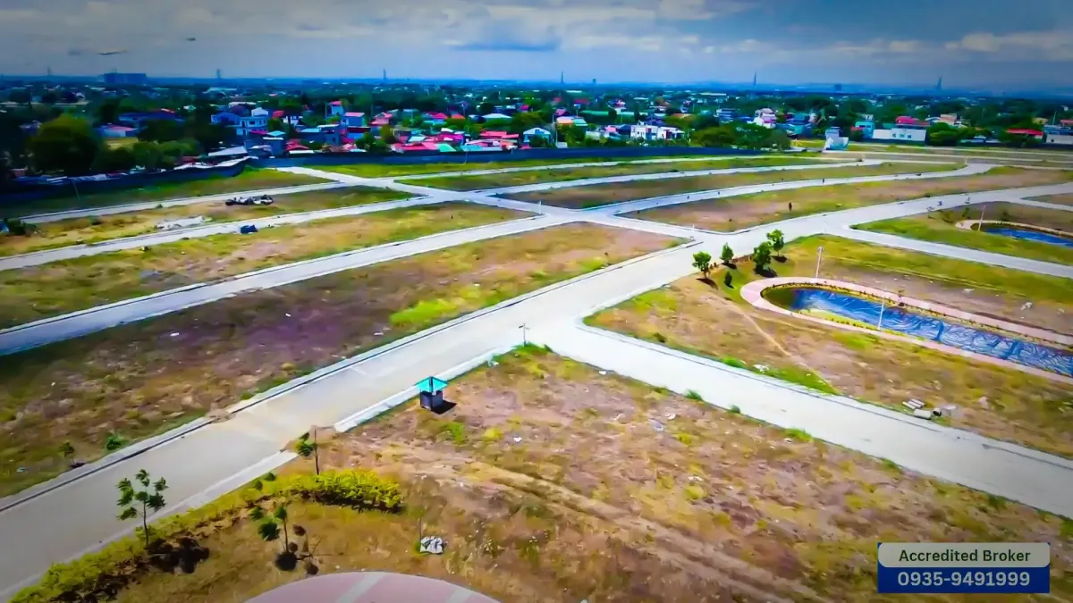 Aerial view of well-planned roads winding through The Lake at St. Charbel, surrounded by lush greenery and serene landscapes.