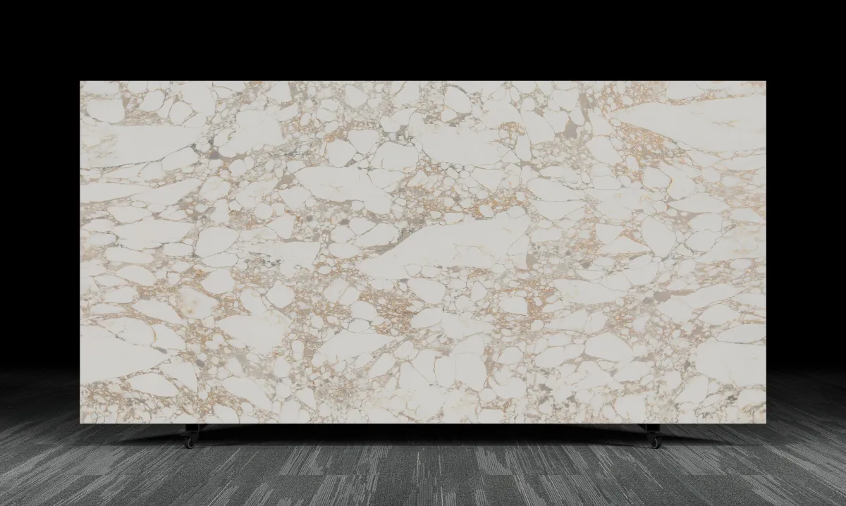 Polished stone slab featuring golden taupe veining across a creamy neutral background, showcasing the Solstice Counter Surface’s warm, sun-washed marble aesthetic.