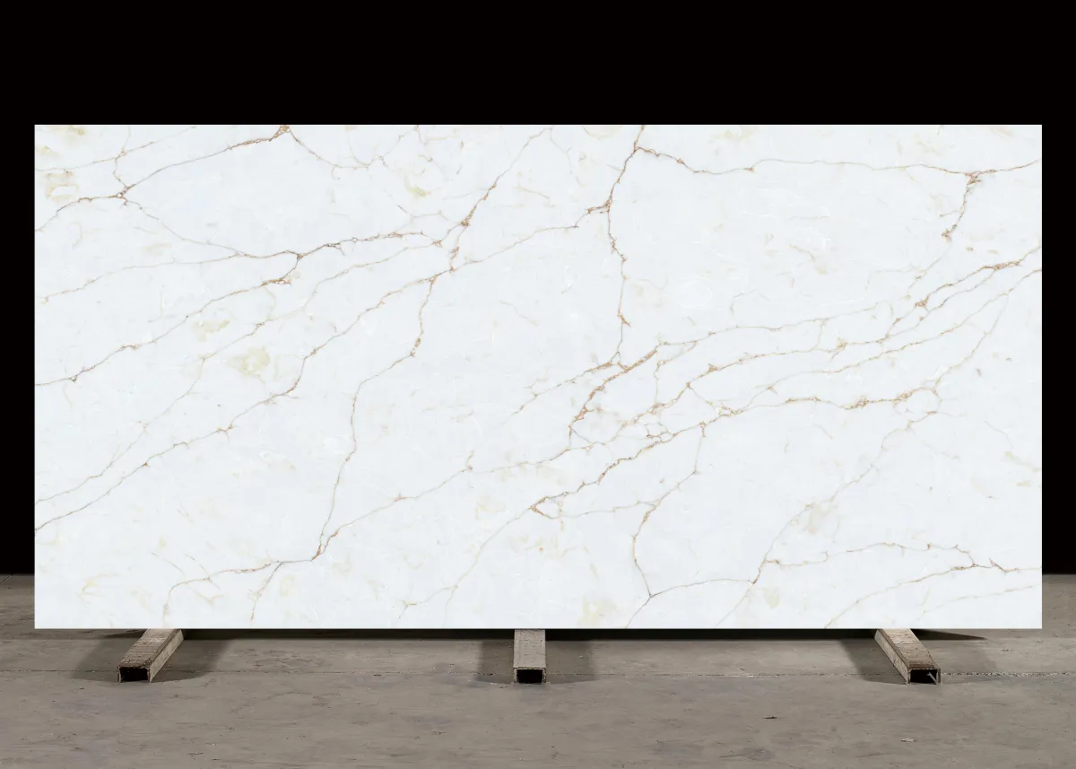 Polished white marble slab with radiant golden veining, showcasing the Golden Hour Counter Surface’s warm and luminous finish inspired by afternoon sunlight.
