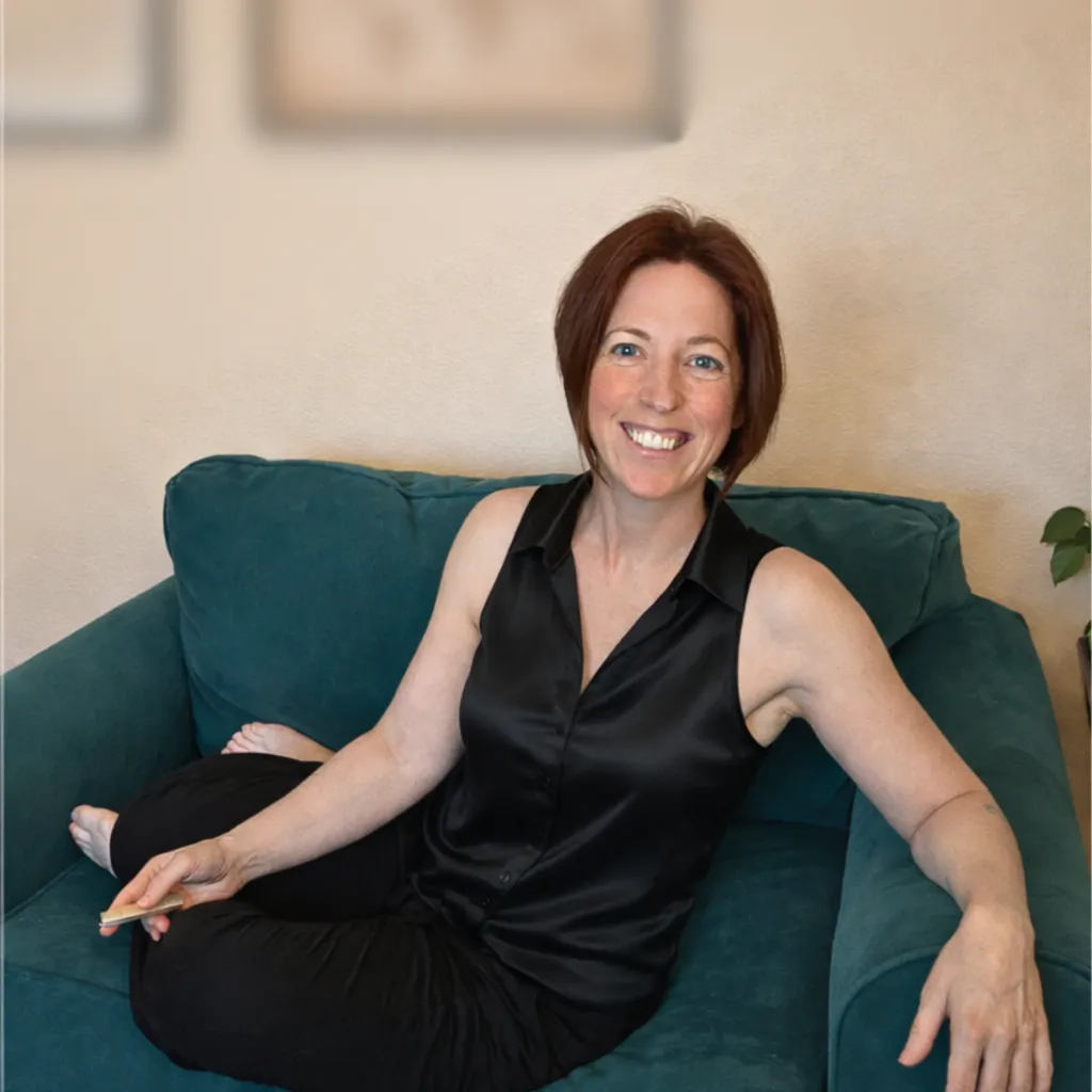 Kirstin Carey Richly Resourced sitting in an office chair