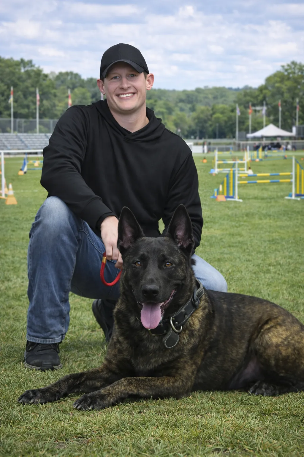 Calm, confident dog with owner during training session