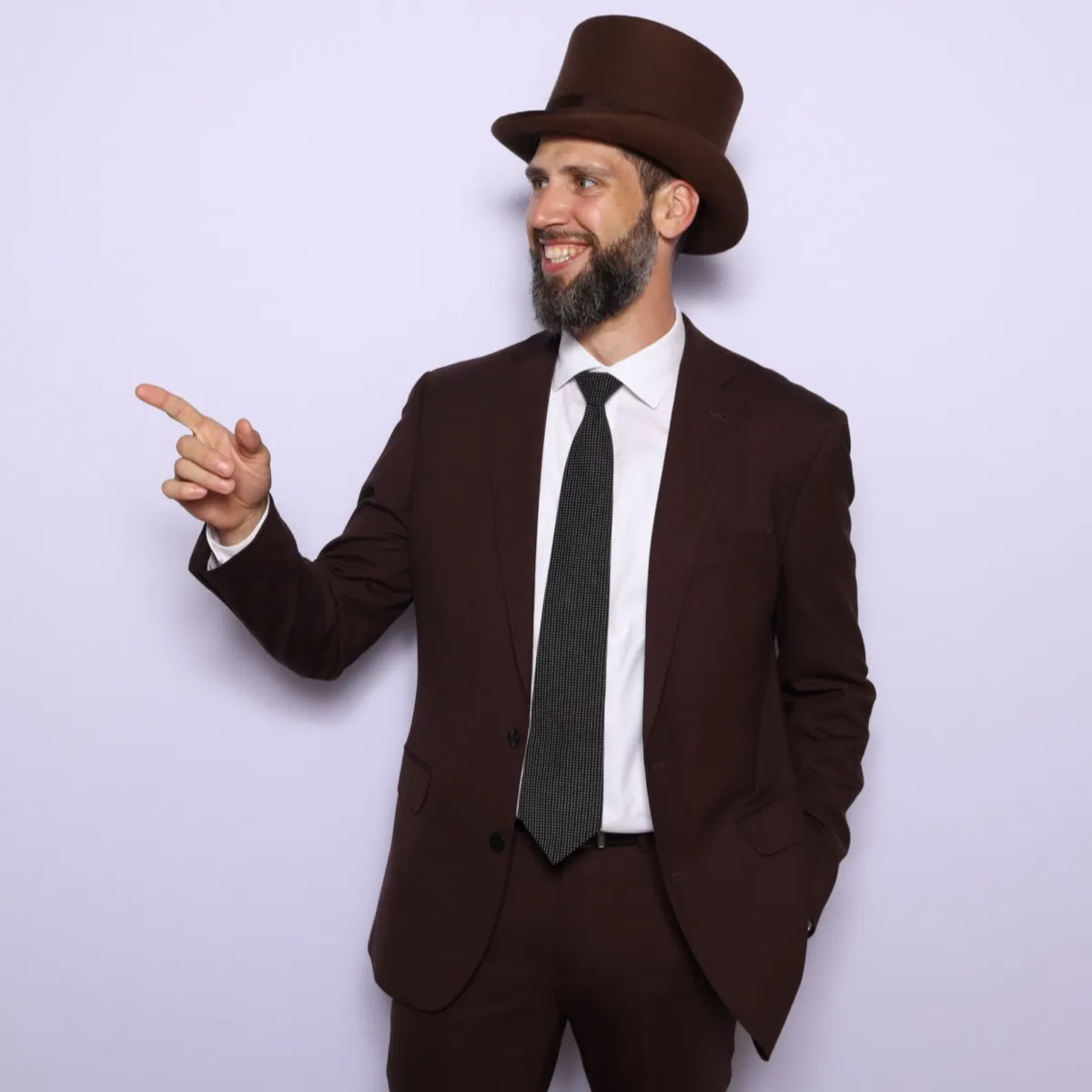 Miles Harding - Wondering Concierge - FAQs - WC Travel & Hospitality - Pointing at questions for page FAQs - Hospitality Marketing 
