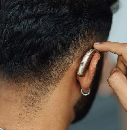 A hearing Aid on A Man's Ear