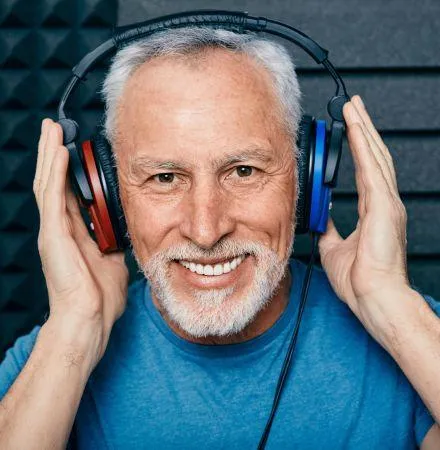 A man wearing headhones about to take a hearing test