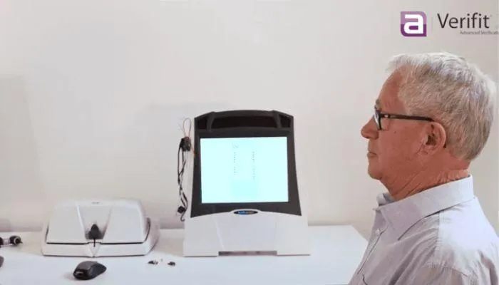 A man has his hearing aid fitting verified with the Verifit 2 Real Ear Measurement