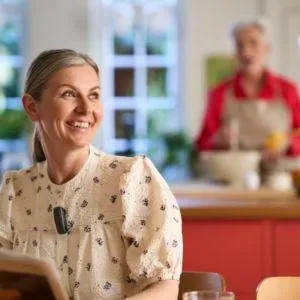 woman smiling at the kitchen table