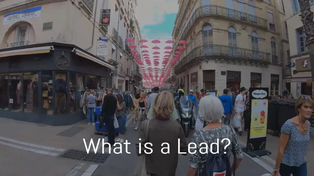 Thumbnail image foe What is a Lead using a fisheye view of a crowded european street fair