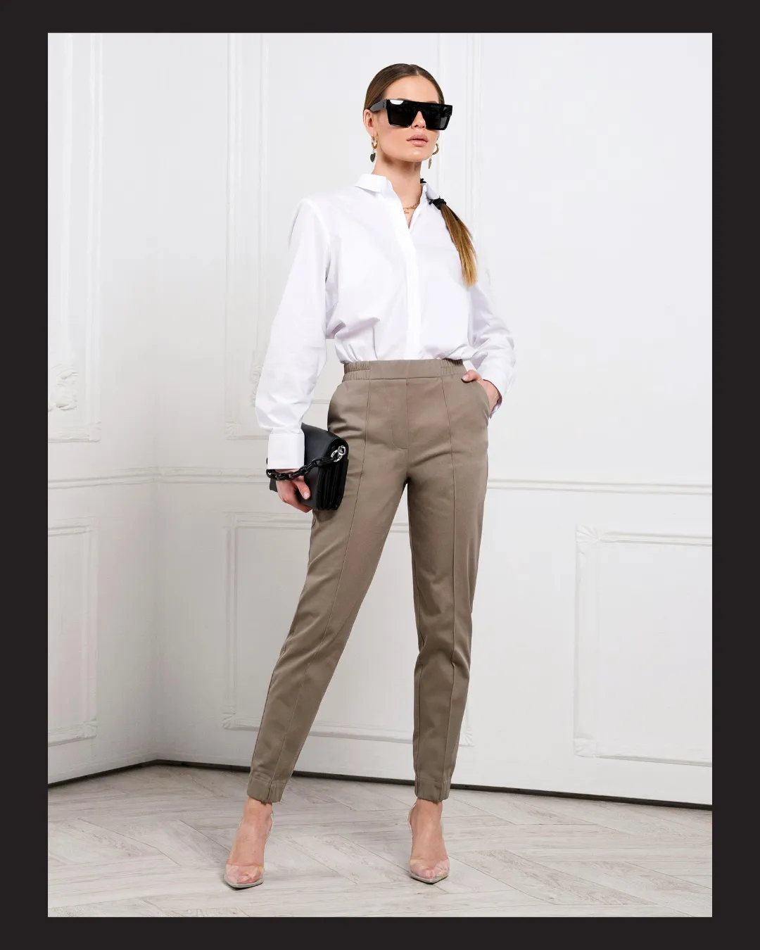 A white bird flying over a body of water