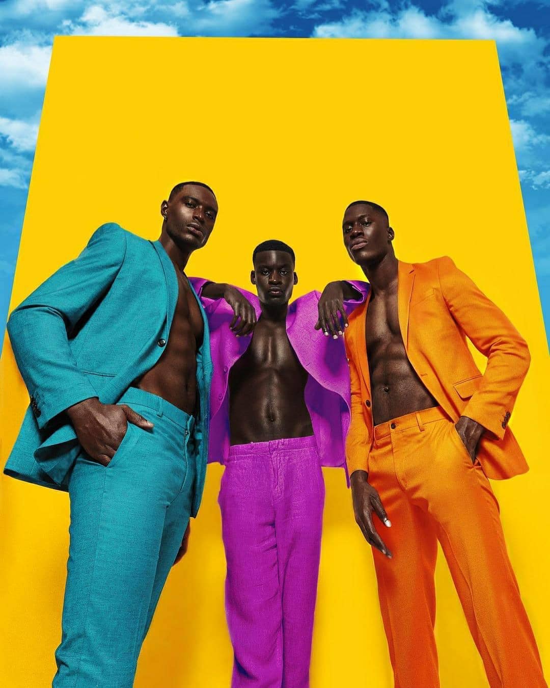 man standing on top of rock mountain during golden hour