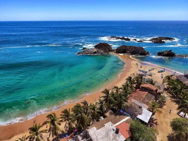 San Agustinillo tranquil cove and fishing lanchas at sunset