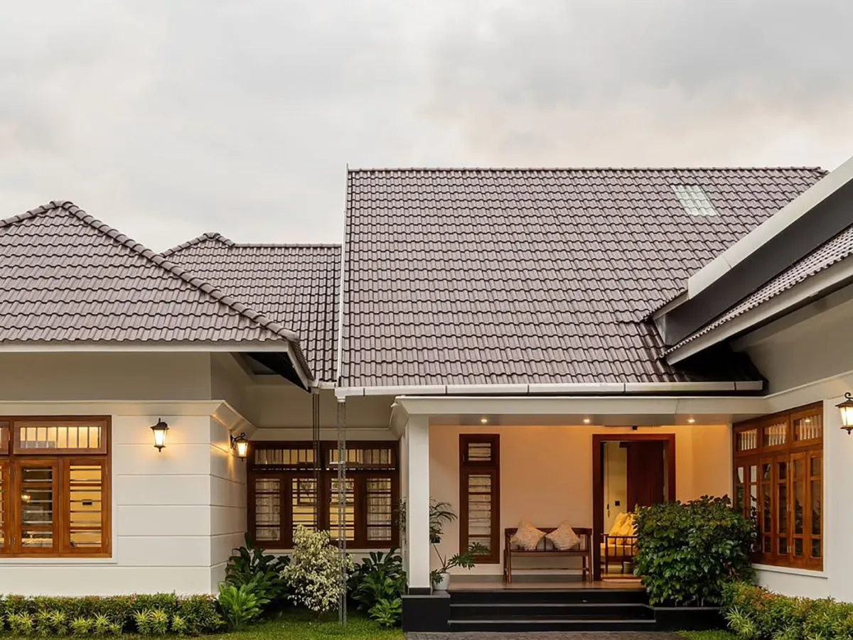 Modern buildings with green roofs and cranes nearby construction cranes.