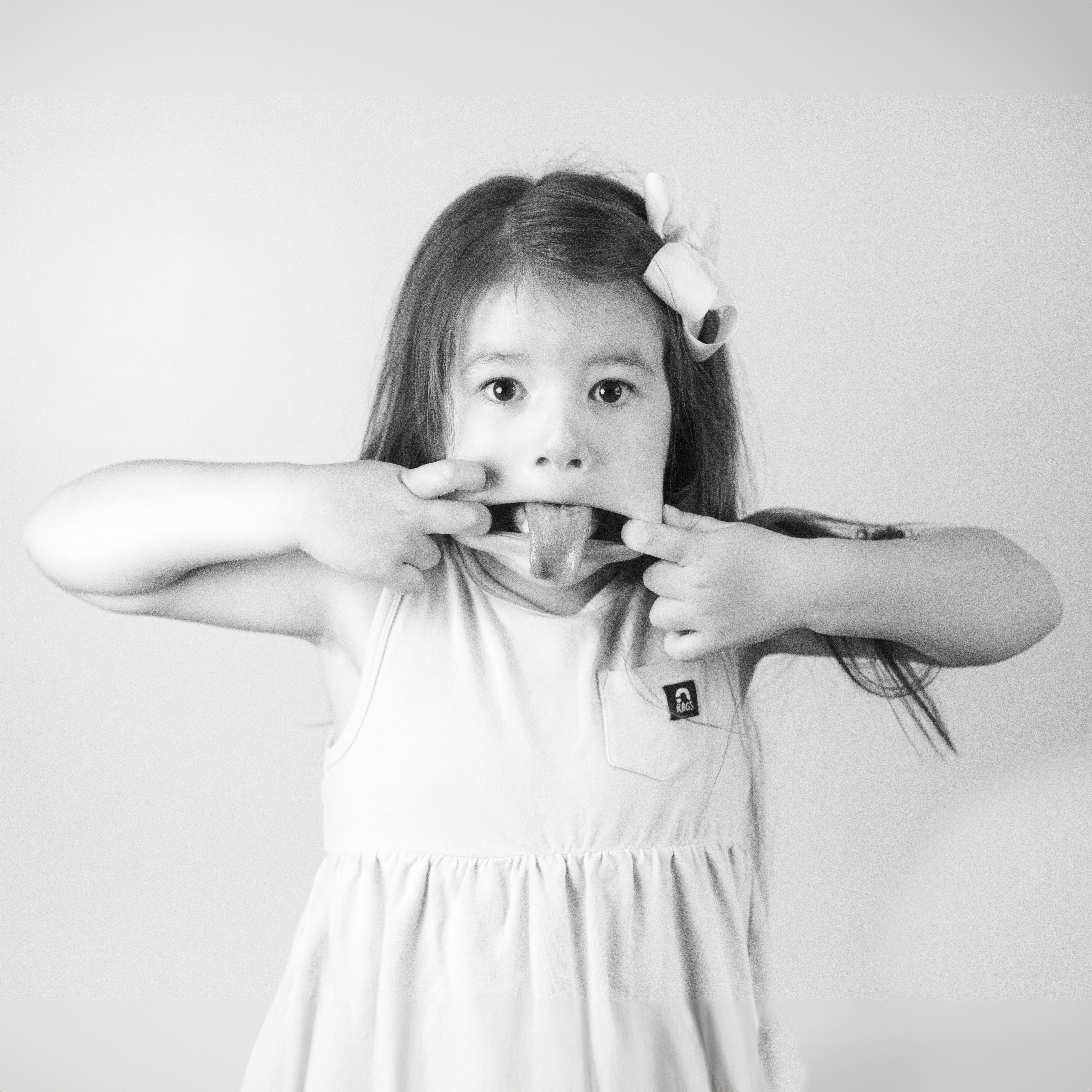 Little girl sticking her tongue out