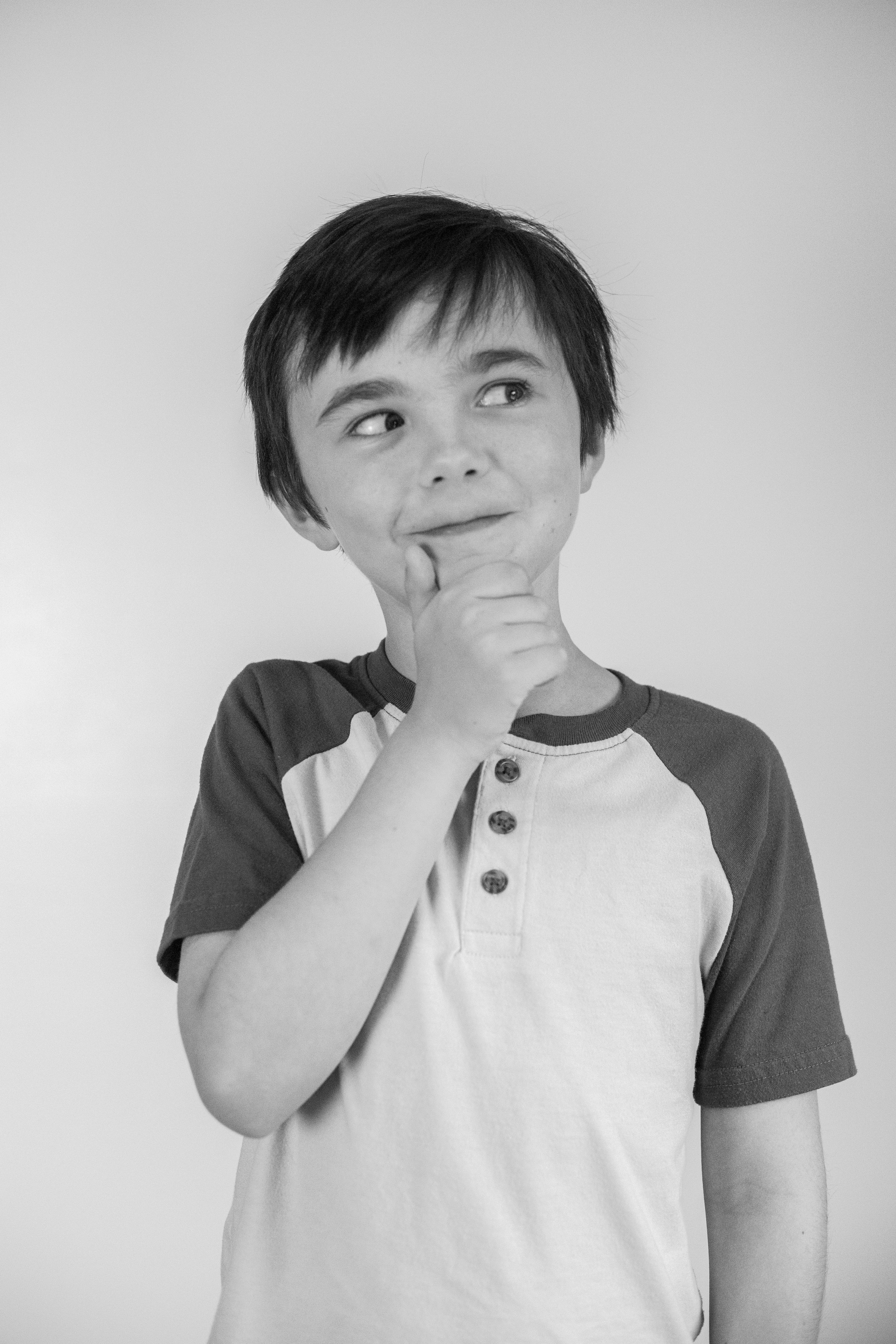 Little boy with a "thinking face"