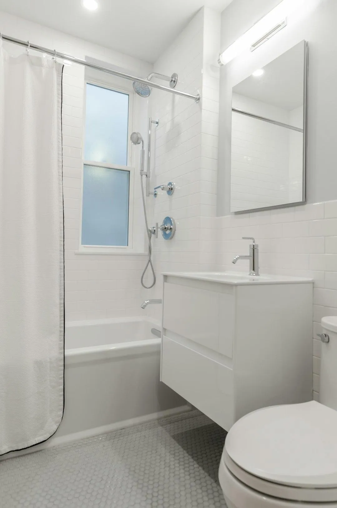 Modern bathroom renovation with frameless glass shower doors in Berkshire