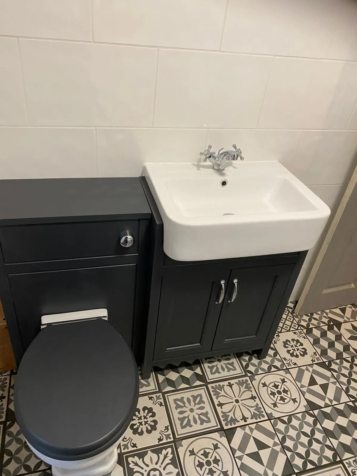 white bathtub near white bathtub