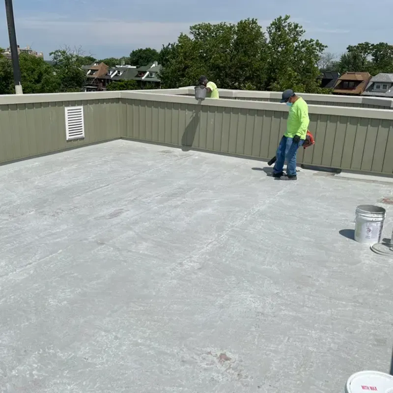 Fiberglass roof installation by Alpha & Omega Fiberglass, workers applying roofing material on residential home.