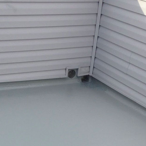 Fiberglass roofing deck with scupper box and waterproof sealant.