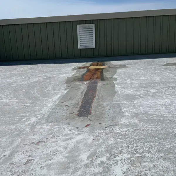 Fiberglass roof patching repair on commercial building in Philadelphia, PA