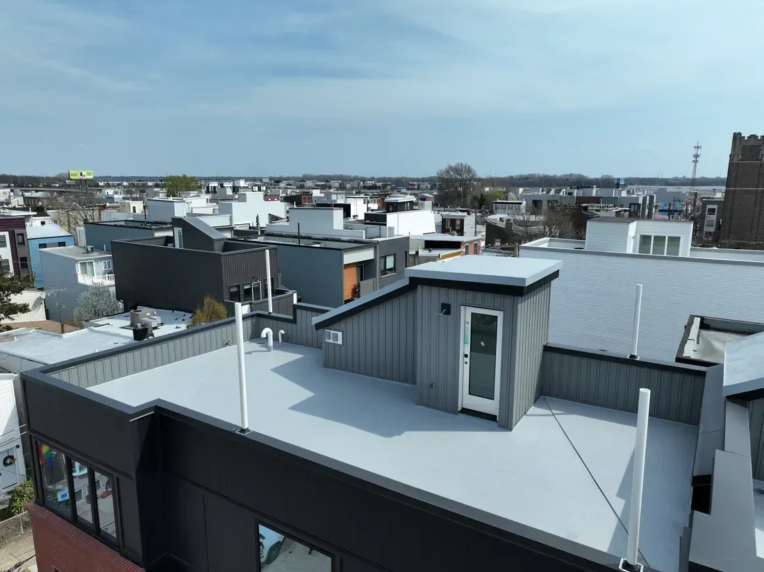 Aerial view of commercial fiberglass roof repair and installation project.