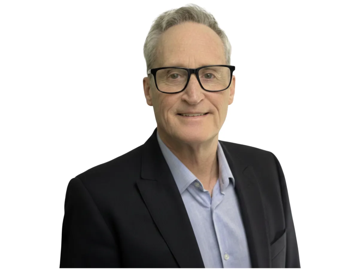 a kitchen with three stools and a center island