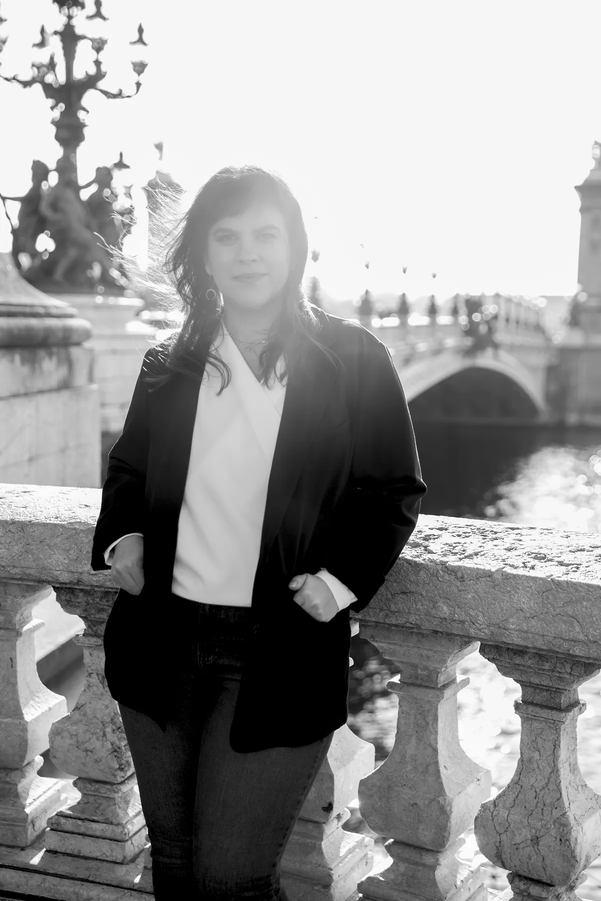 Lynnette by a bridge in Paris, black-and-white portrait
