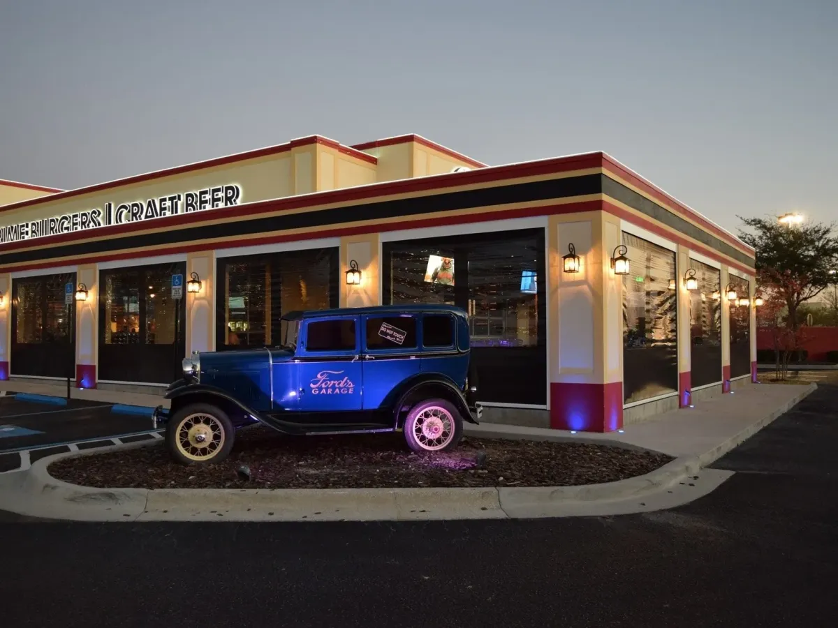 MaxForce motorized hurricane screens installed on commercial outdoor dining area of retro-style Florida restaurant