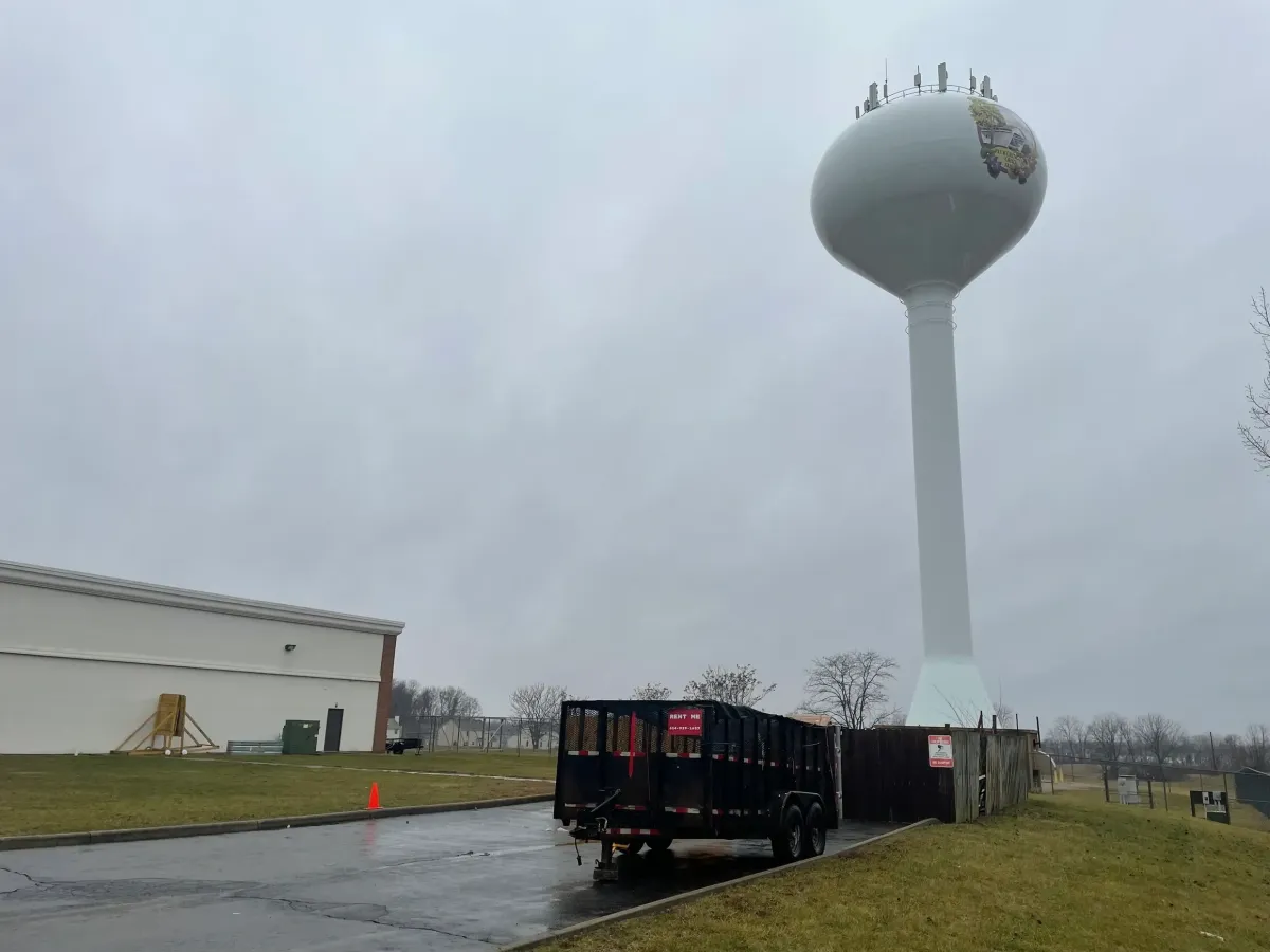 A table with baskets of fruit and vegetables on it