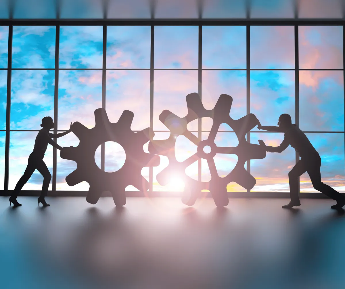 A calculator sitting on top of a pile of money