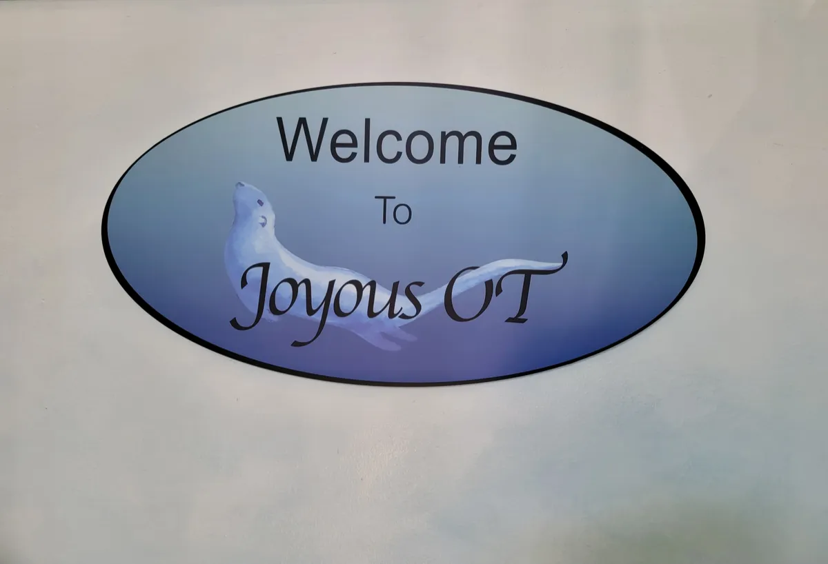 Welcome to Joyous OT sign with sea lion logo