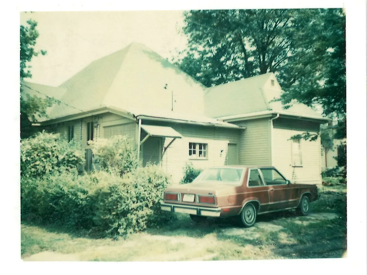 Vintage photo of the house with a car in the driveway